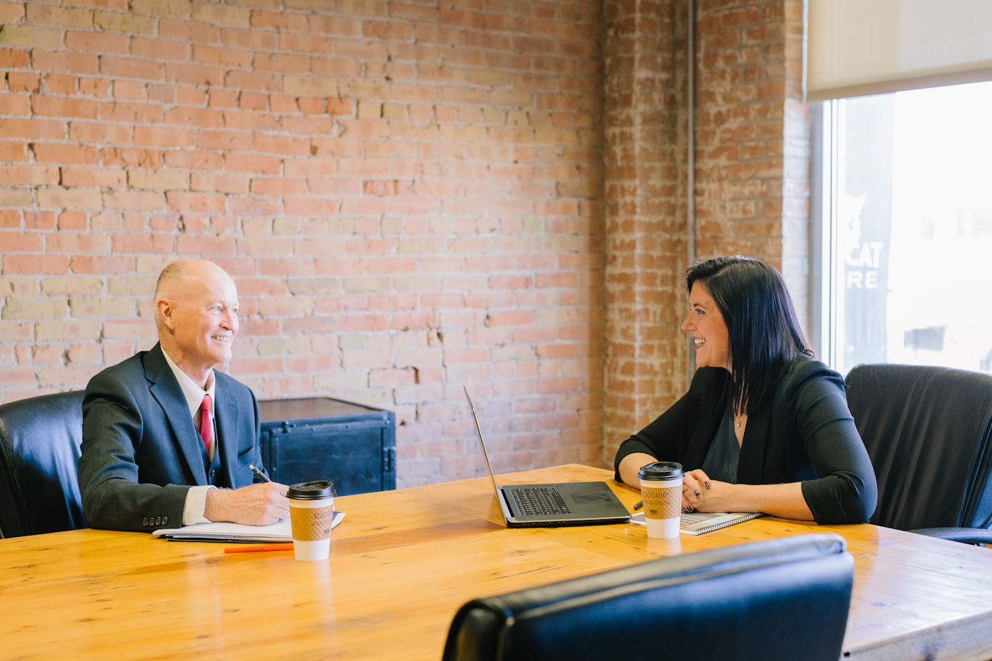 Lawyers meeting with a client in an office