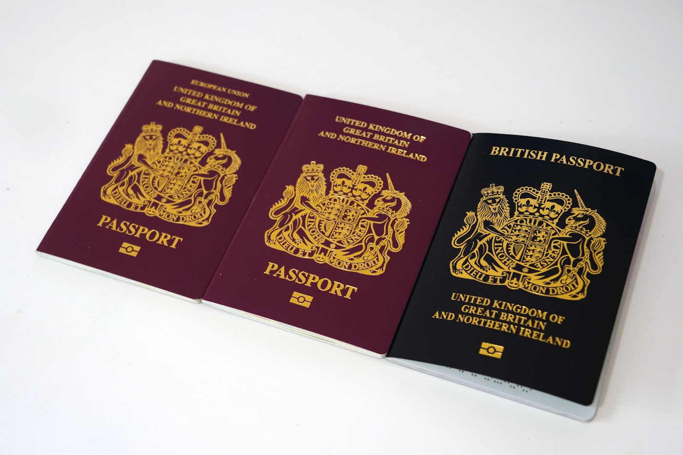 A UK passport and visa documents on a desk
